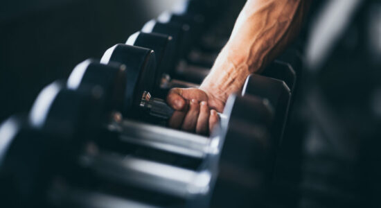 Rows of dumbbells in the gym with hand